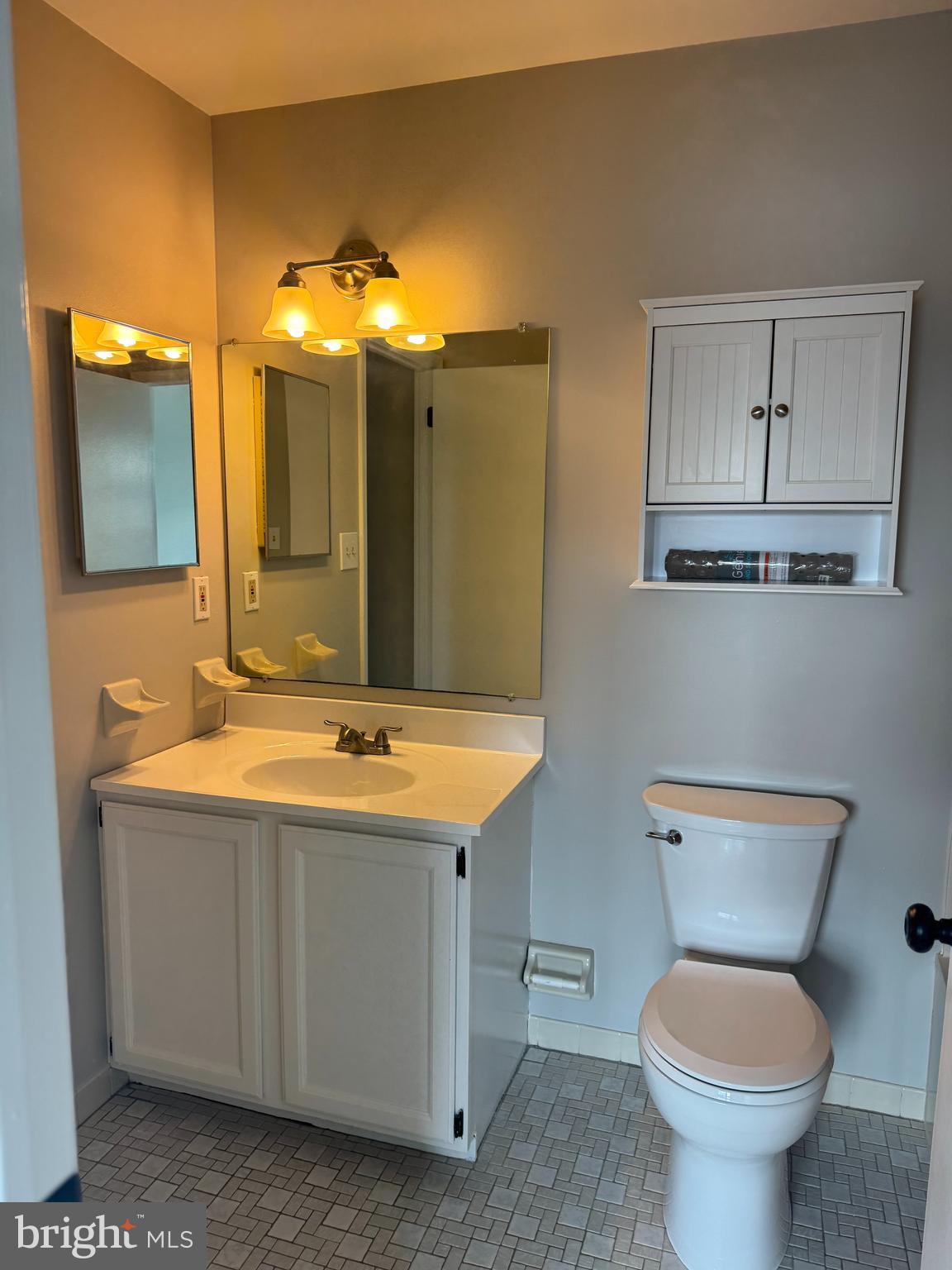 1031 Rafter Road Norristown, PA 19403 - Photo 11 of 17 a bathroom with a toilet sink and mirror