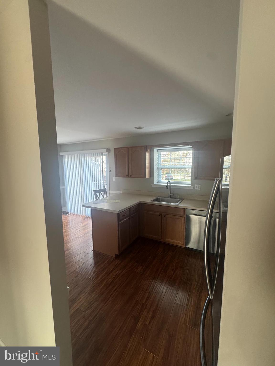 1031 Rafter Road Norristown, PA 19403 - Photo 4 of 17 a view of kitchen and hall with wooden floor