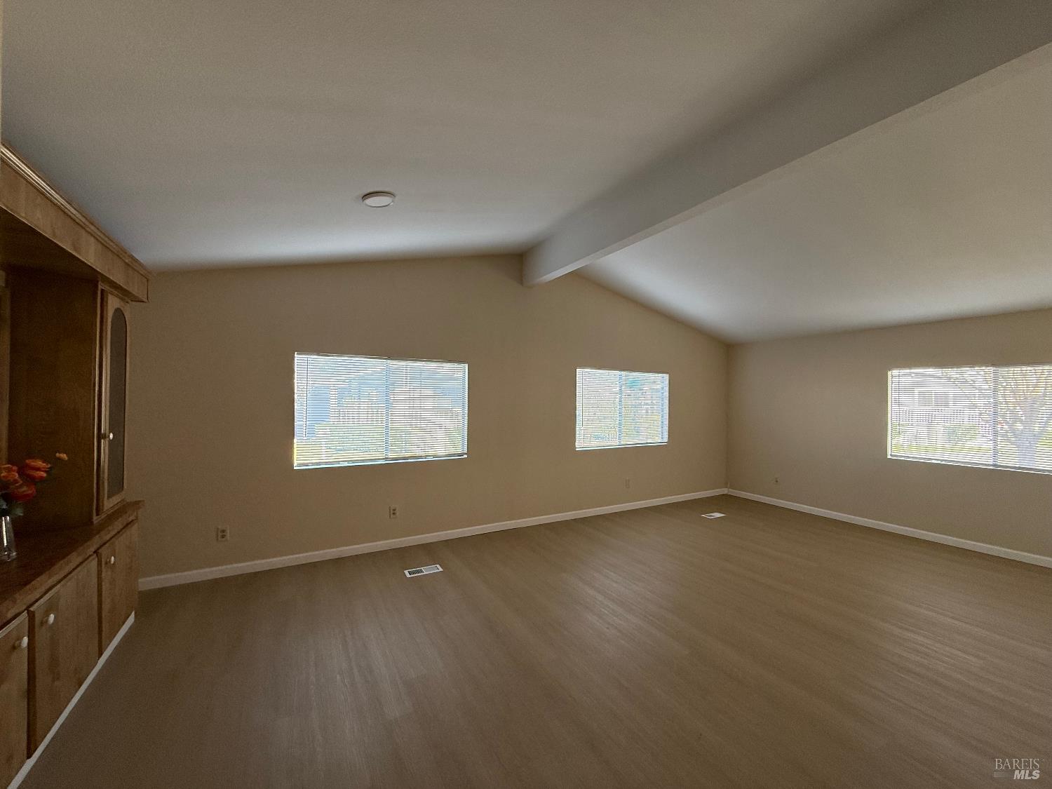 190 Apple Lane Santa Rosa, CA 95407 - Photo 11 of 23 a view of an empty room with wooden floor and a window