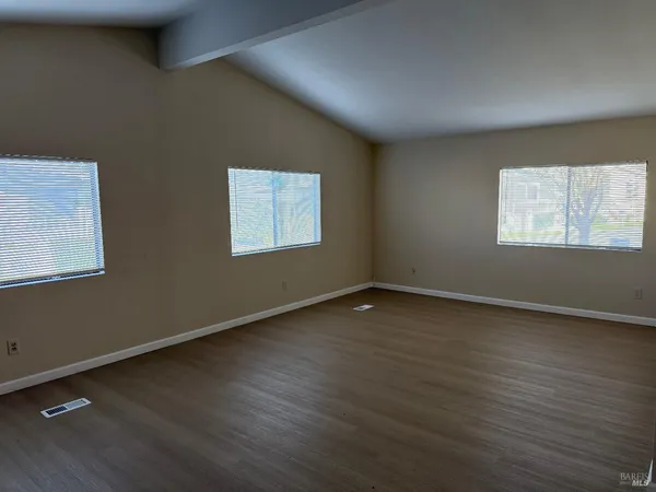 a view of a kitchen from the hallway