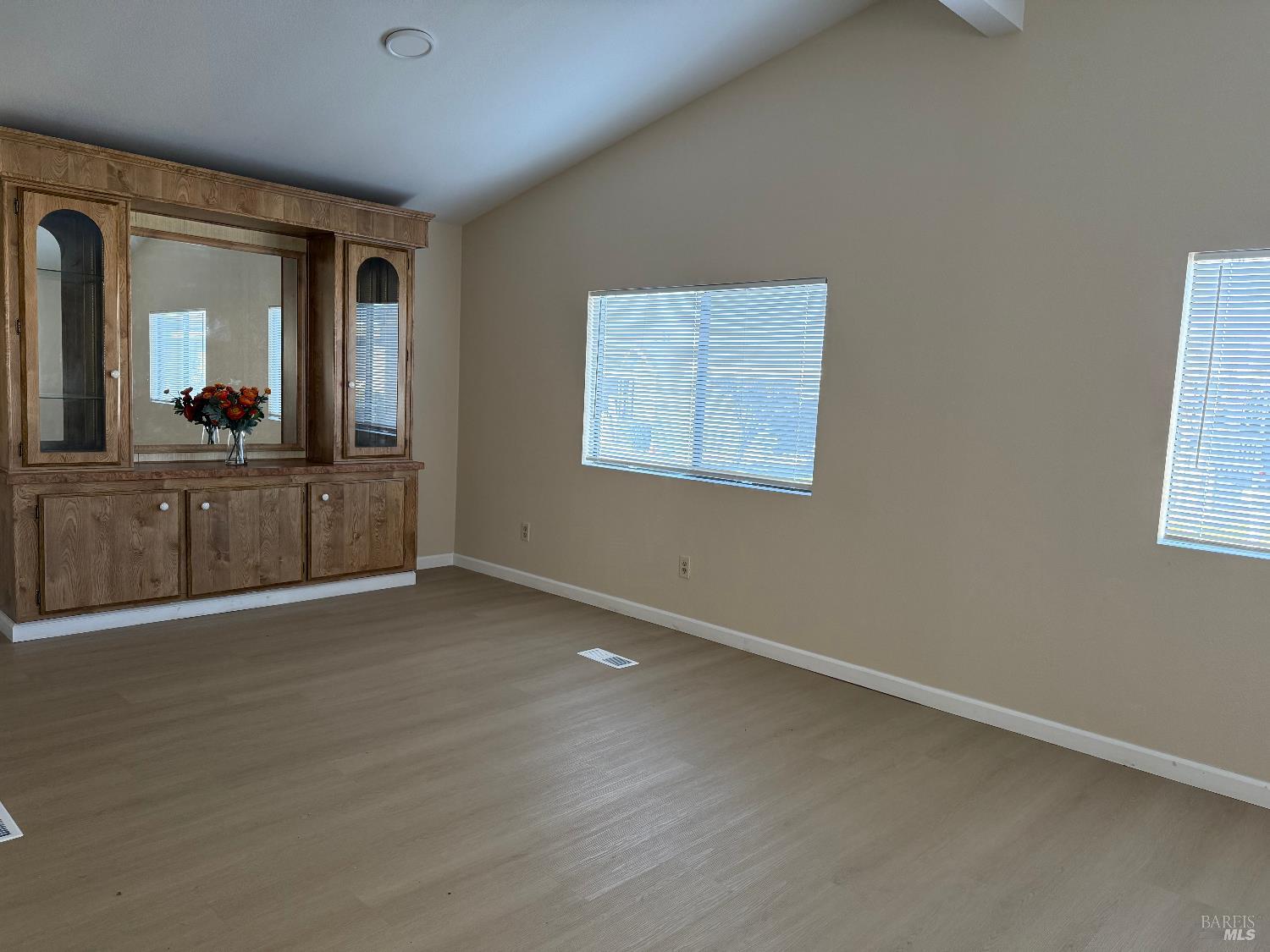 190 Apple Lane Santa Rosa, CA 95407 - Photo 9 of 23 an empty room with wooden floor and cabinet