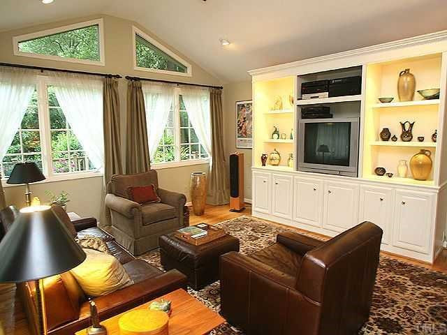 2605 Wells Avenue Raleigh, NC 27608 - Photo 3 of 12 Gorgeous family room, oversized deck and new roof were added in 2003. The new family room features cusom built-in entertainment center, 3M filtered windows, recessed lighting, ceiling fan and pre-wiring for security. Den/Family/Great Room