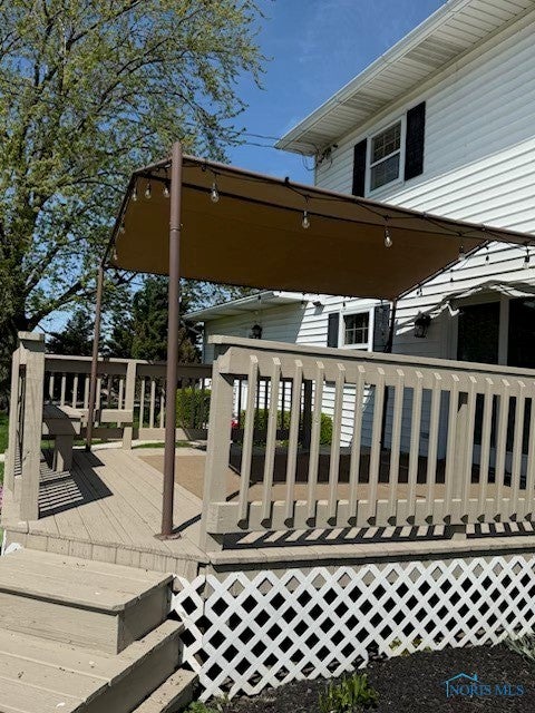 Covered deck with lights.