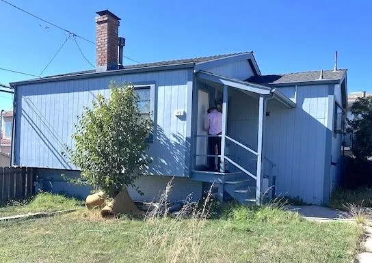 an empty room with windows and entrance