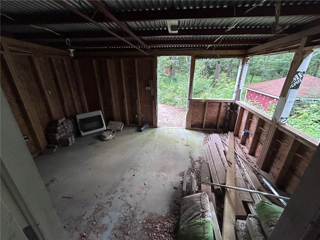 8916 Highway 166 Winston, GA 30187 - Photo 36 of 52 a bed sitting in a bedroom next to a window