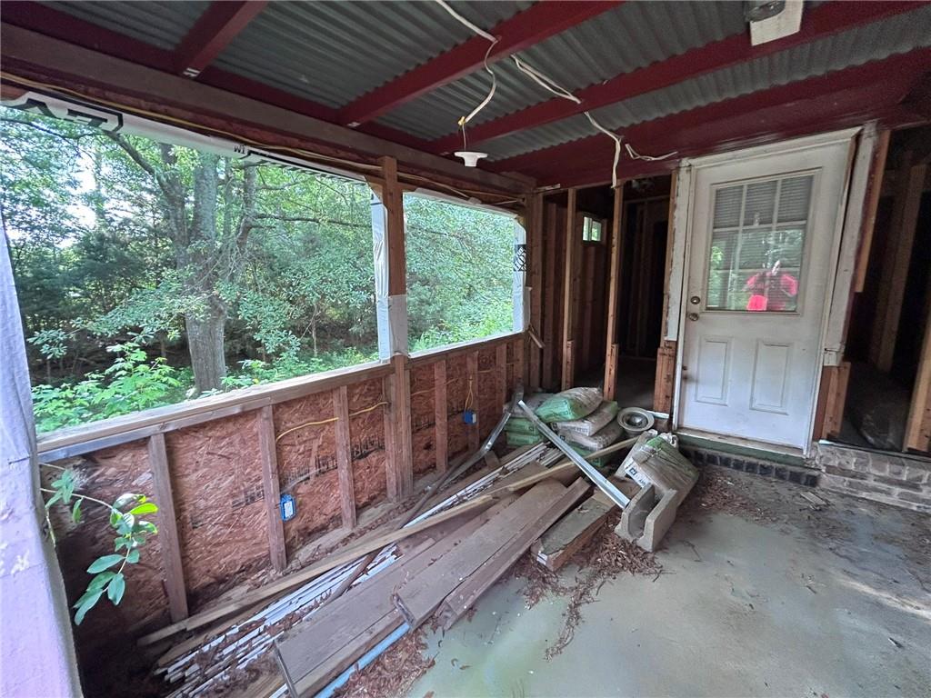 8916 Highway 166 Winston, GA 30187 - Photo 39 of 52 a porch with wooden floor