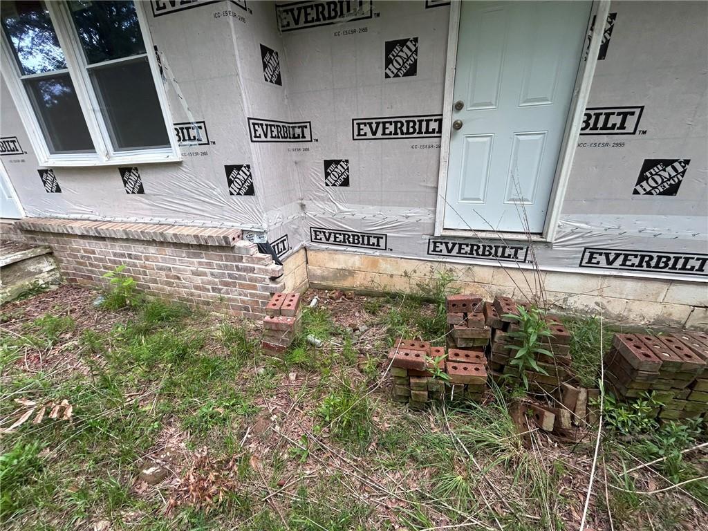 8916 Highway 166 Winston, GA 30187 - Photo 4 of 52 a view of a chairs and table in a backyard
