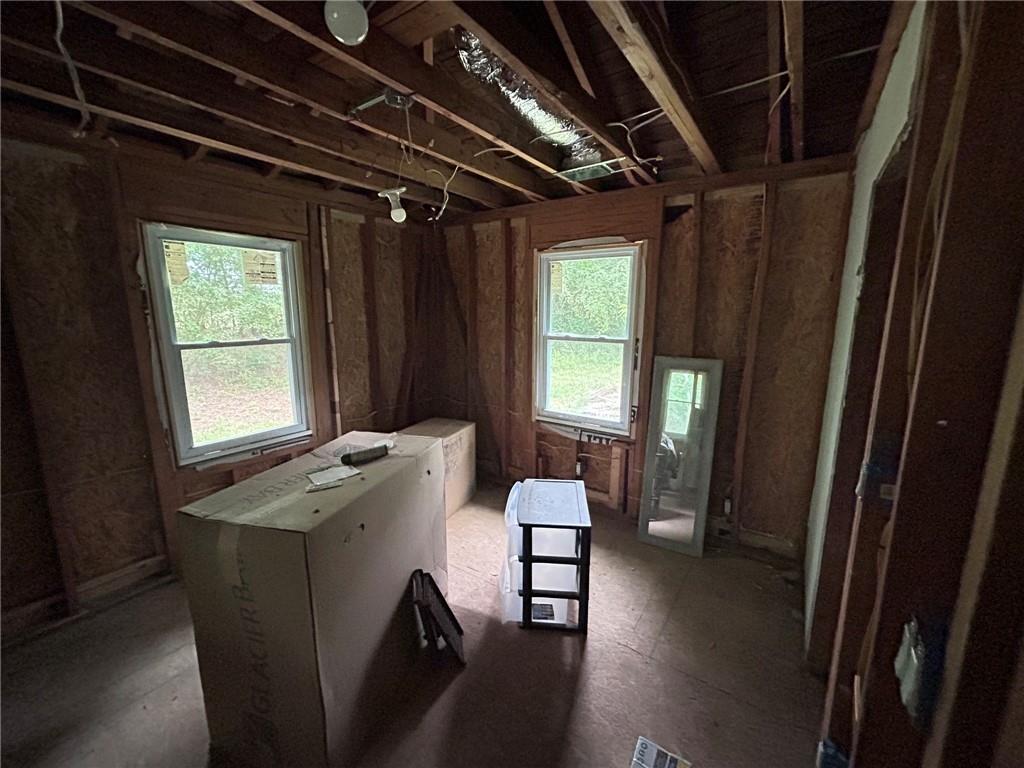 8916 Highway 166 Winston, GA 30187 - Photo 45 of 52 a room with wooden floor and furniture