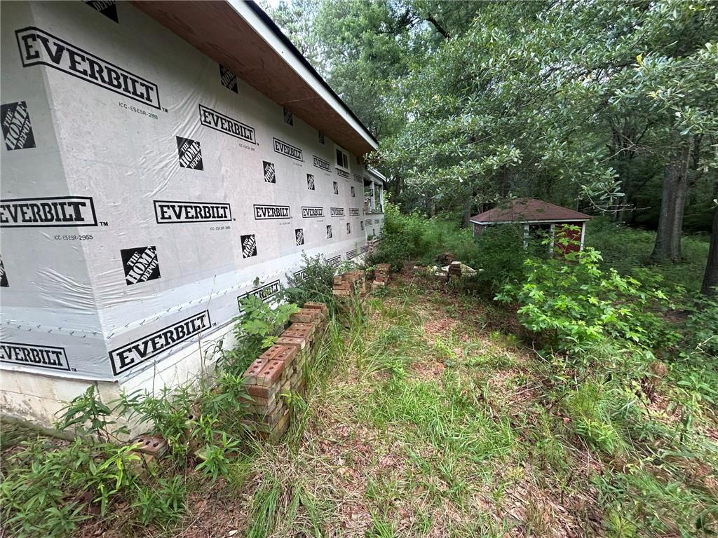 8916 Highway 166 Winston, GA 30187 - Photo 6 of 52 a view of a house with a yard and garden