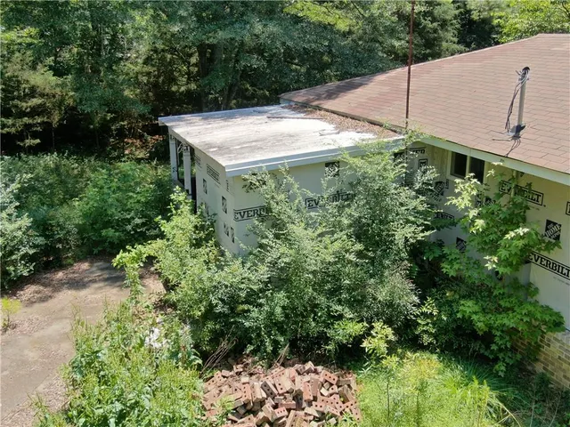 an aerial view of residential house with an outdoor space