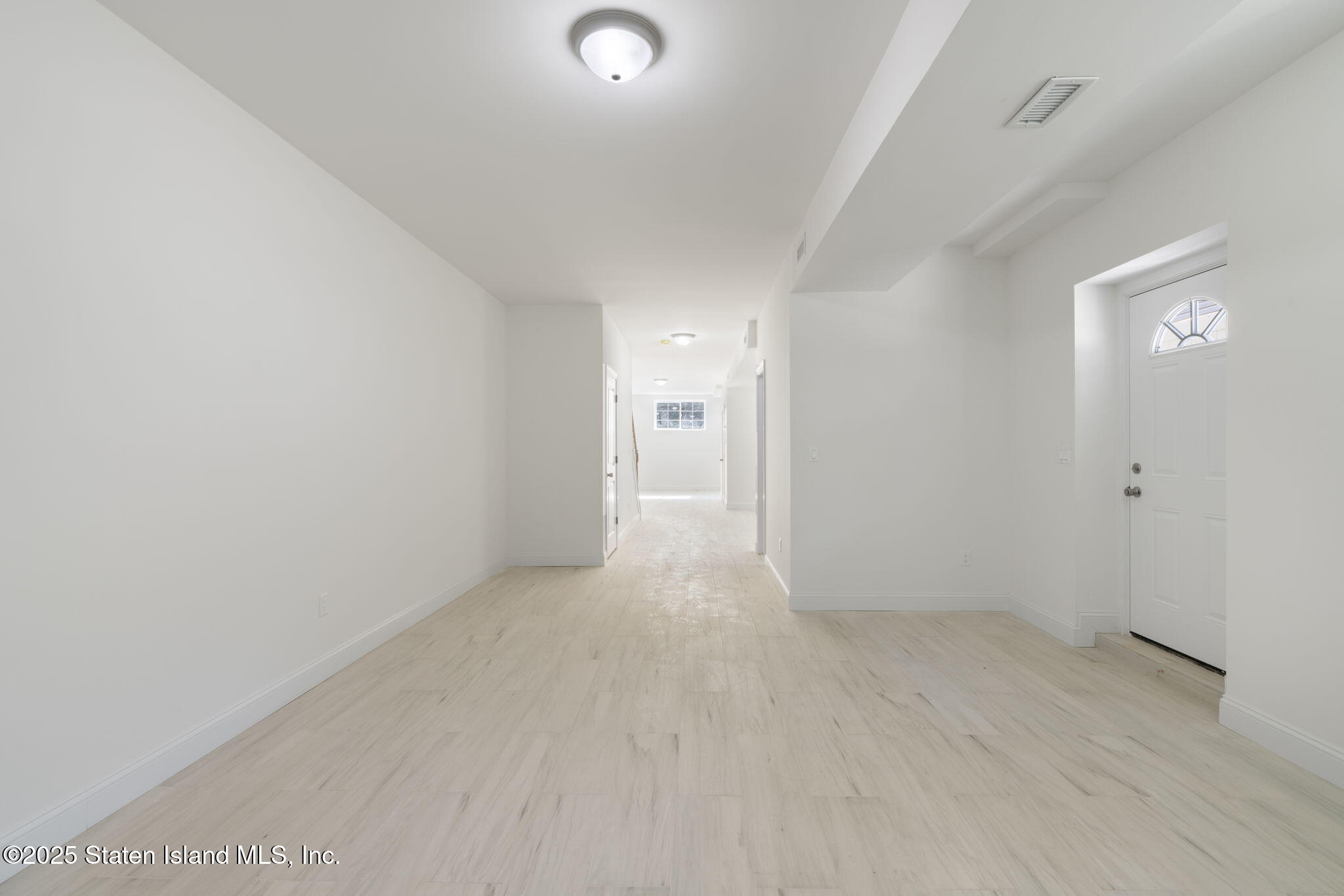 1372 Forest Hill Road, Unit 1A Staten Island, NY 10314 - Photo 18 of 25 wooden floor in a room