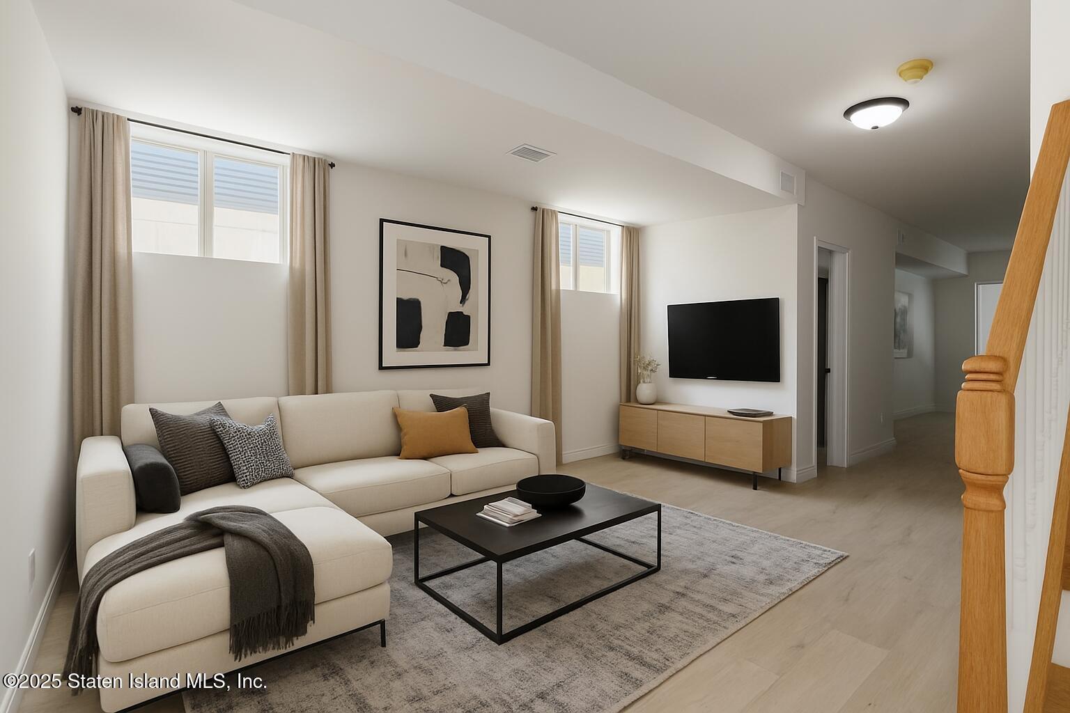 1372 Forest Hill Road, Unit 1A Staten Island, NY 10314 - Photo 3 of 25 a living room with furniture and a flat screen tv