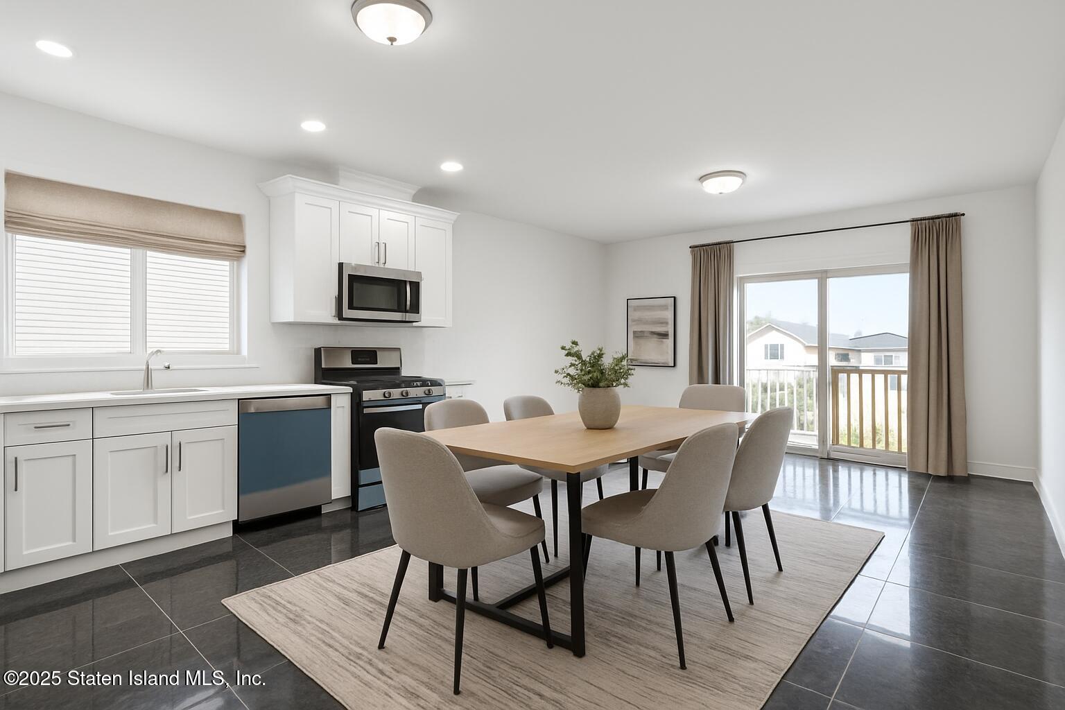 1372 Forest Hill Road, Unit 1A Staten Island, NY 10314 - Photo 5 of 25 a view of a dining room with furniture and wooden floor