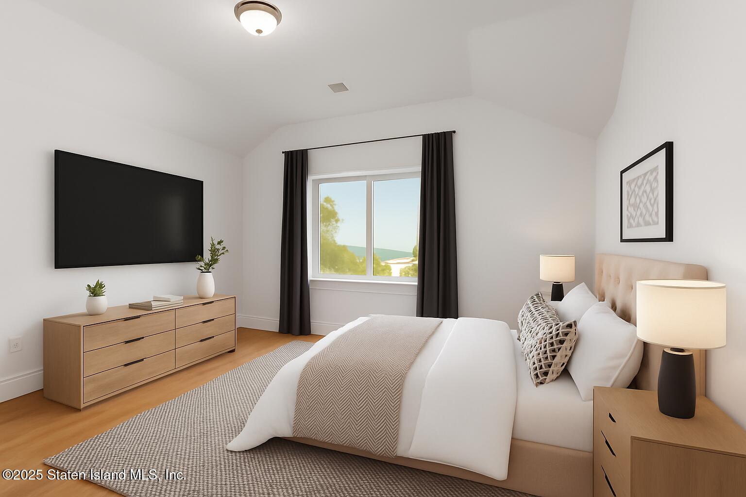 1372 Forest Hill Road, Unit 1A Staten Island, NY 10314 - Photo 6 of 25 a bedroom with a bed and a flat screen tv