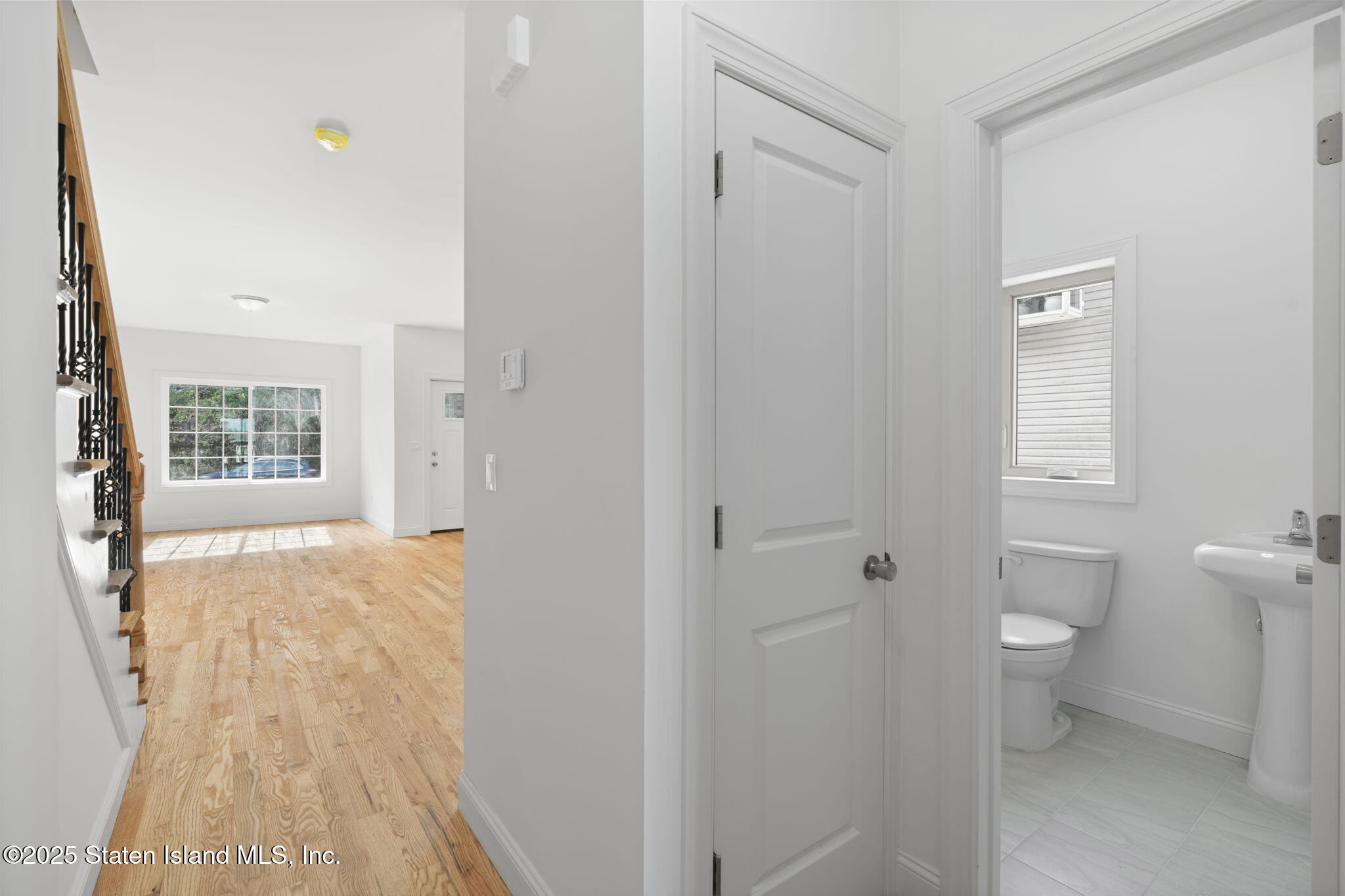 1372 Forest Hill Road, Unit 1A Staten Island, NY 10314 - Photo 9 of 25 a bathroom with a sink and a toilet