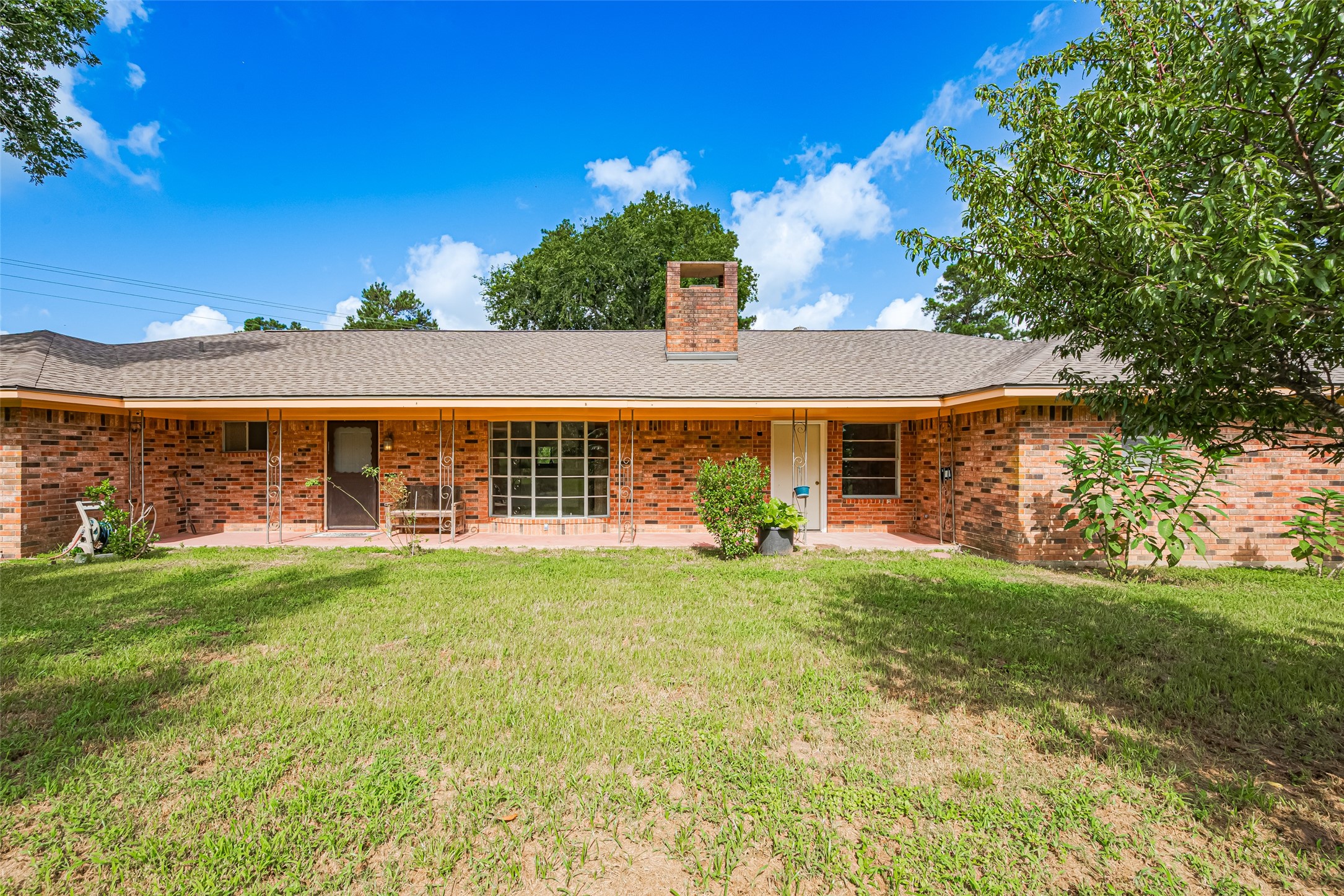 30525 Hegar Road Hockley, TX 77447 - Photo 3 of 49 a view of a house with backyard sitting area and garden