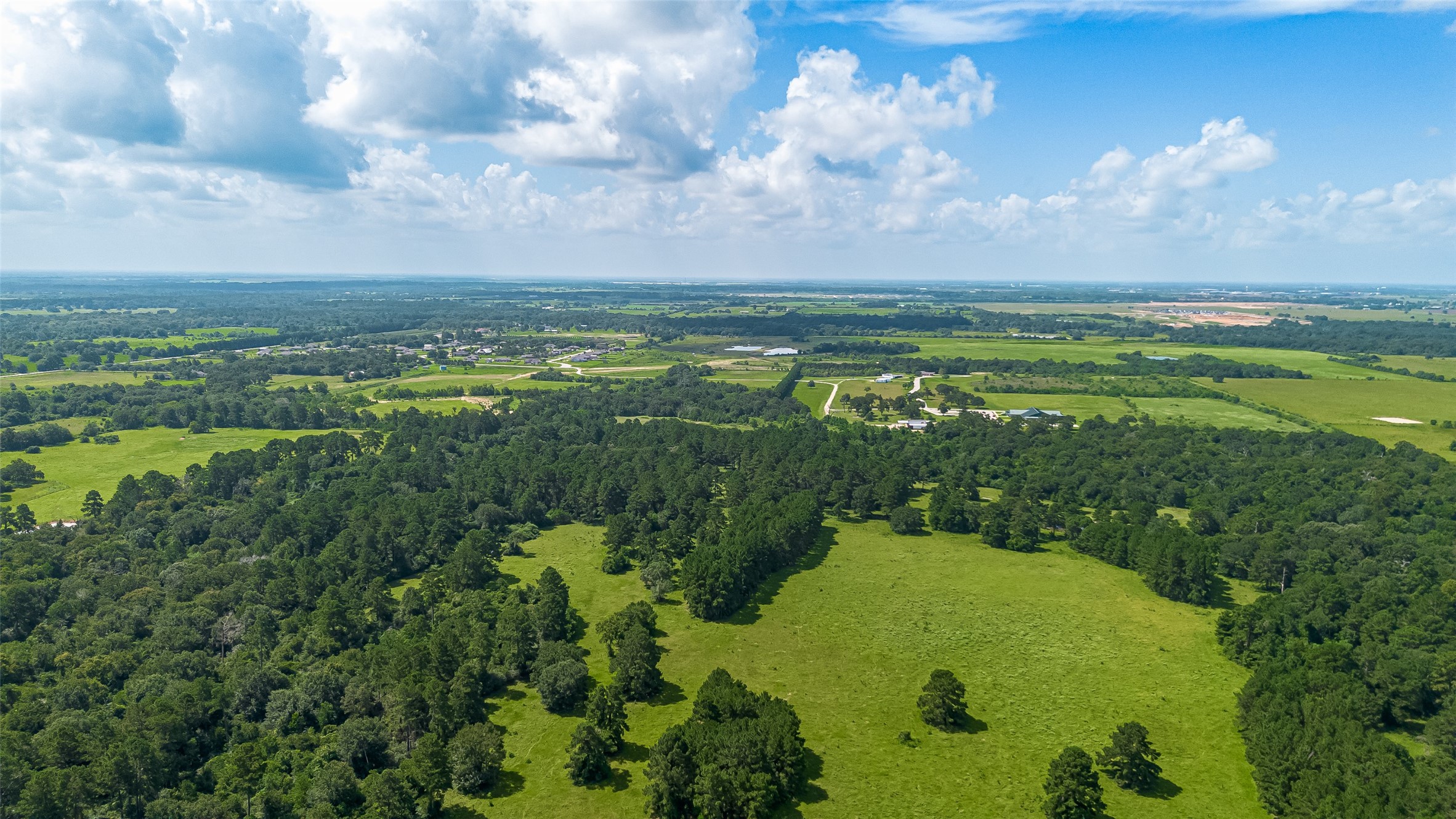 30525 Hegar Road Hockley, TX 77447 - Photo 47 of 49 a view of a lake with a yard