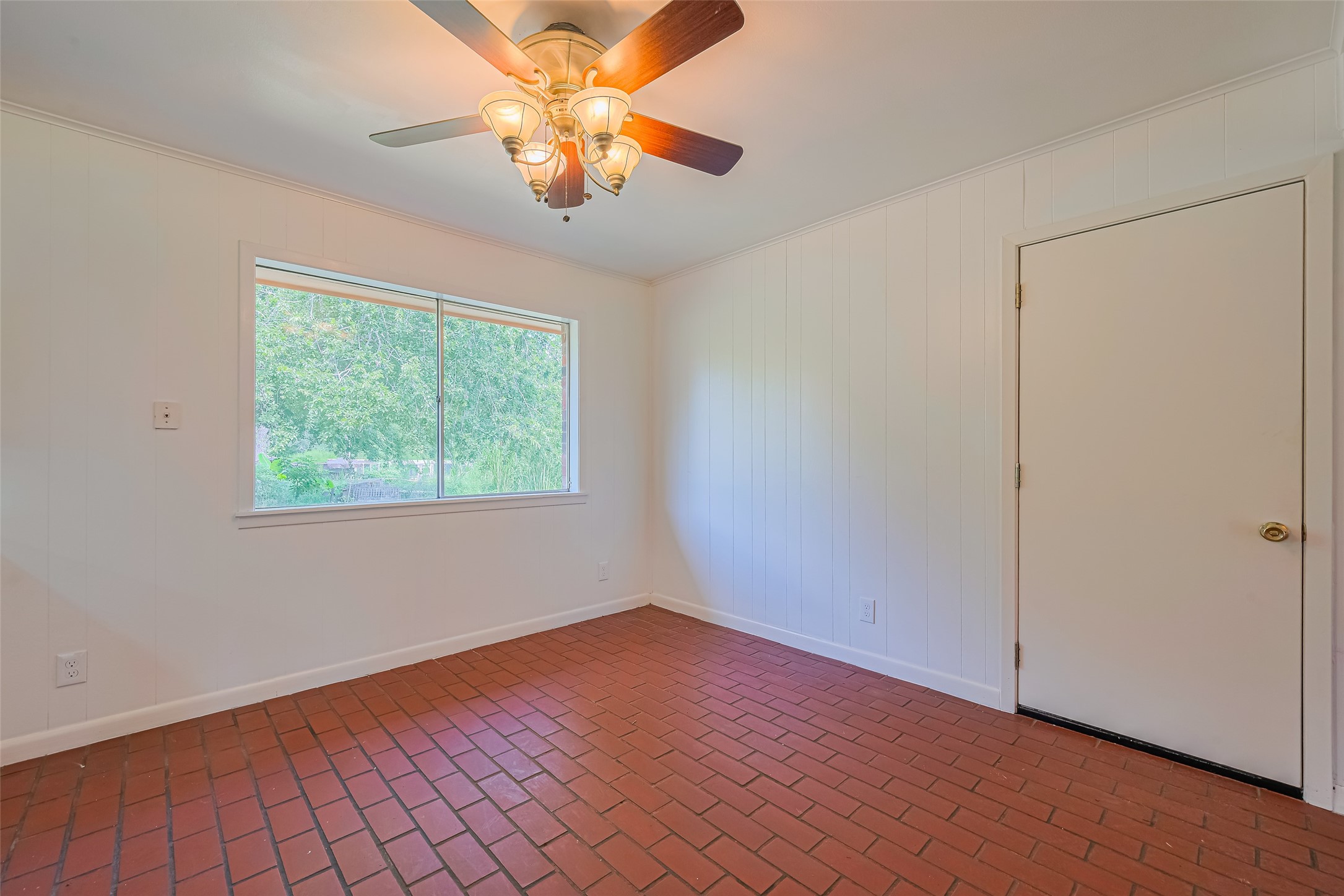 30525 Hegar Road Hockley, TX 77447 - Photo 10 of 49 an empty room with wooden floor chandelier fan and windows
