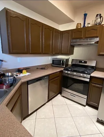 a kitchen with a stove and a microwave
