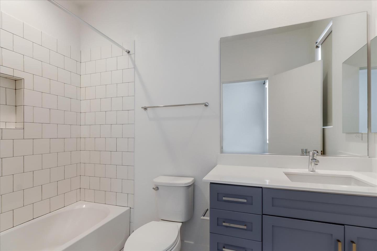 152 Uptown Circle Oakland, CA 94607 - Photo 25 of 33 a bathroom with a sink toilet a mirror and shower