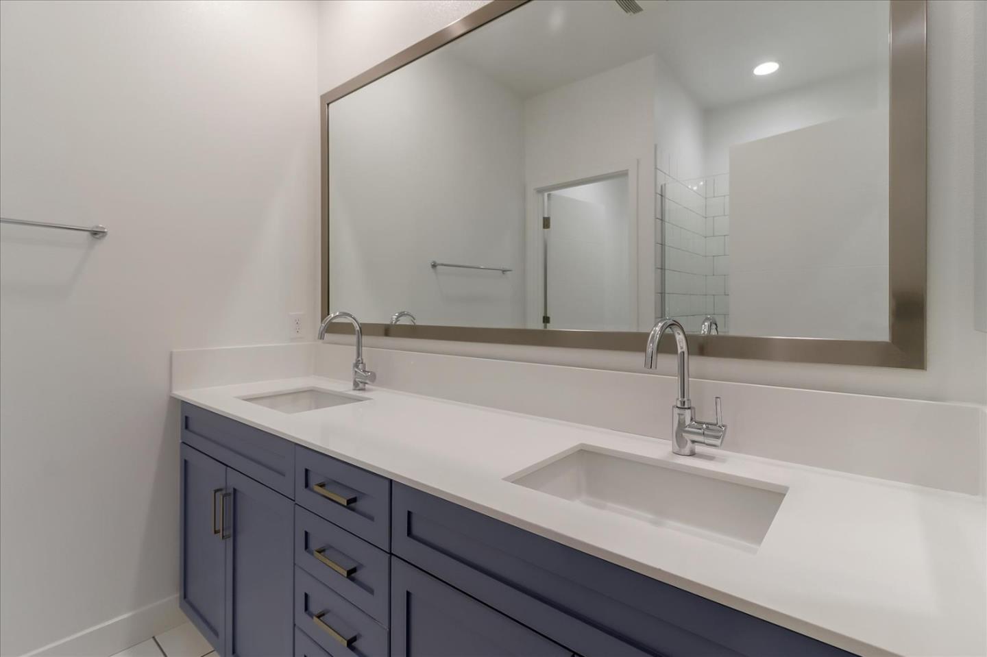 152 Uptown Circle Oakland, CA 94607 - Photo 26 of 33 a bathroom with a sink and a mirror