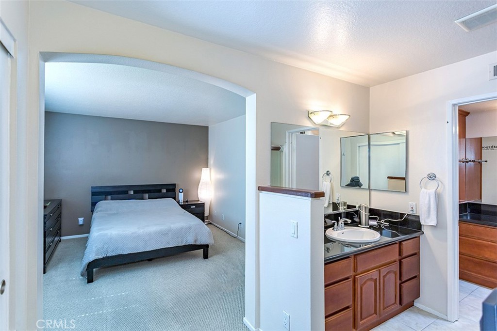 7065 9th Street, Unit 1 Buena Park, CA 90621 - Photo 16 of 36 a kitchen with sink refrigerator and stove