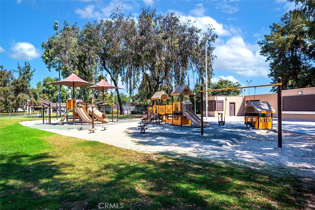7065 9th Street, Unit 1 Buena Park, CA 90621 - Photo 29 of 36 a view of a park with swings and slides