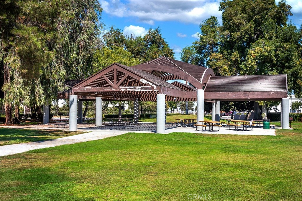 7065 9th Street, Unit 1 Buena Park, CA 90621 - Photo 31 of 36 a patio with a table and chairs and a big yard