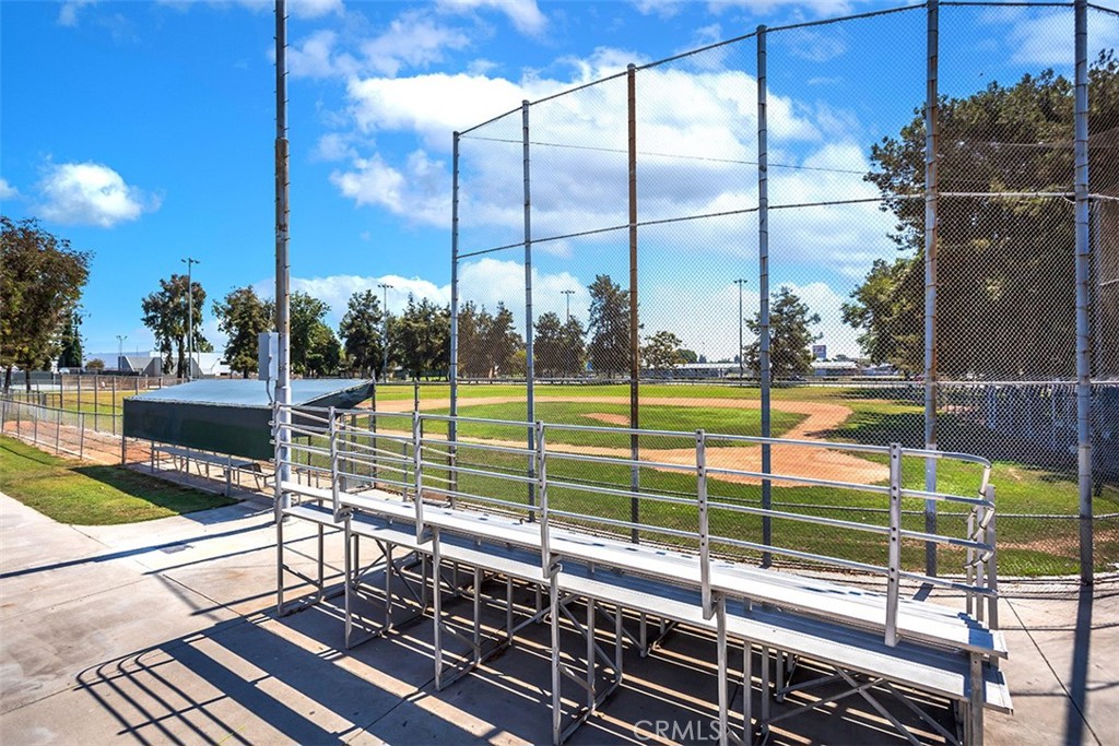 7065 9th Street, Unit 1 Buena Park, CA 90621 - Photo 34 of 36 a view of a balcony with floor to ceiling window next to a yard