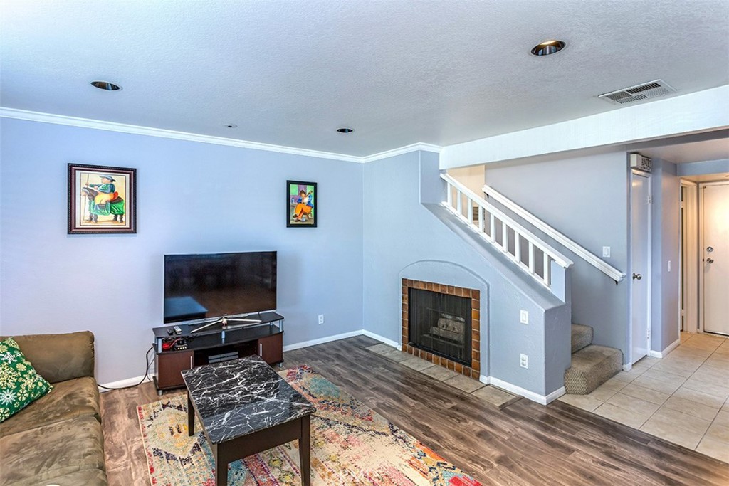 7065 9th Street, Unit 1 Buena Park, CA 90621 - Photo 5 of 36 a living room with furniture and a flat screen tv