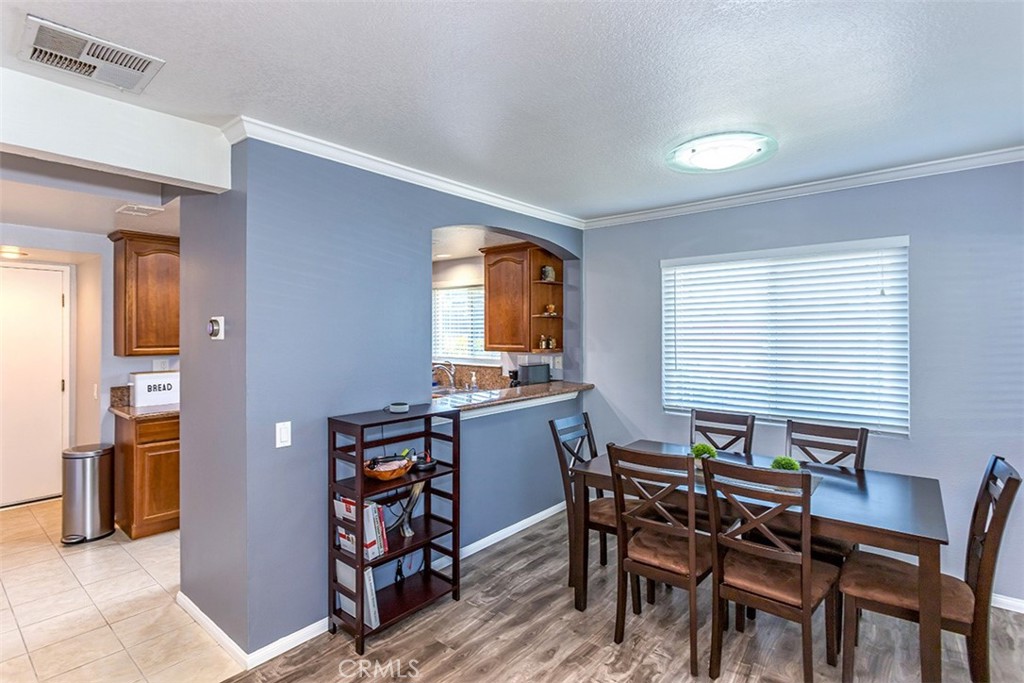 7065 9th Street, Unit 1 Buena Park, CA 90621 - Photo 7 of 36 a dining room with furniture and window