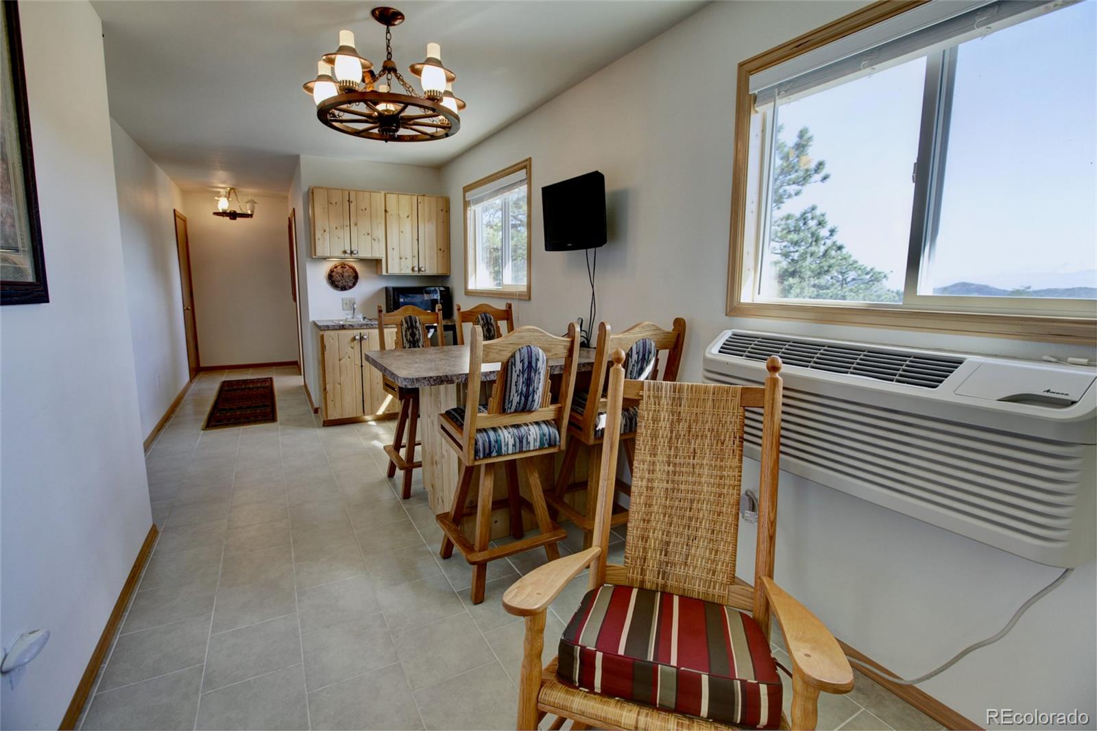 530 Red Feather Road Cotopaxi, CO 81223 - Photo 36 of 46 a view of a dining room with furniture and chandelier