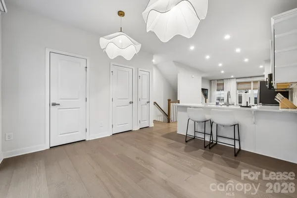 a view of kitchen with furniture and wooden floor