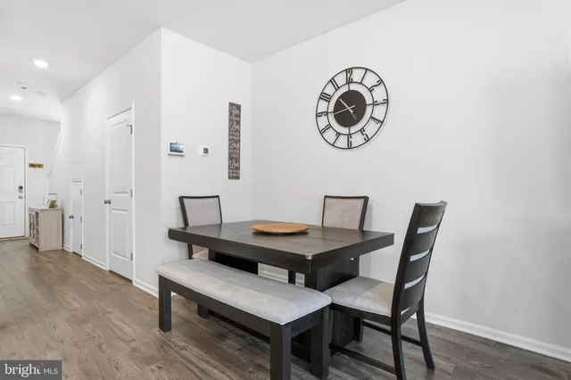 a view of a room with furniture and wooden floor