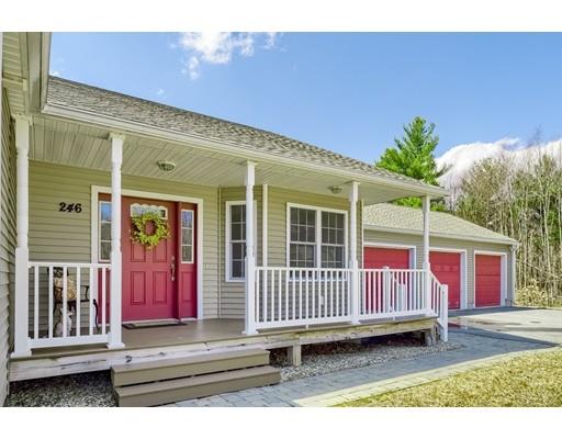 246 Pleasantdale Road Rutland, MA 01543 - Photo 1 of 29 a view of a house with a small yard and wooden floor and fence