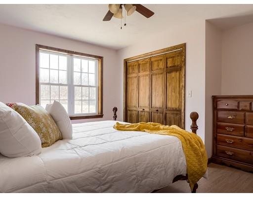 246 Pleasantdale Road Rutland, MA 01543 - Photo 18 of 29 a bedroom with a large bed and a large window