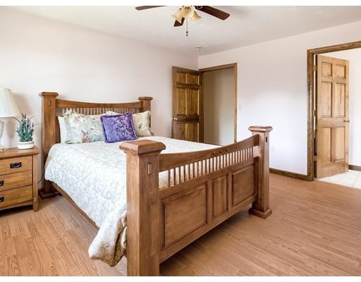 246 Pleasantdale Road Rutland, MA 01543 - Photo 19 of 29 a bedroom with a bed and a dresser