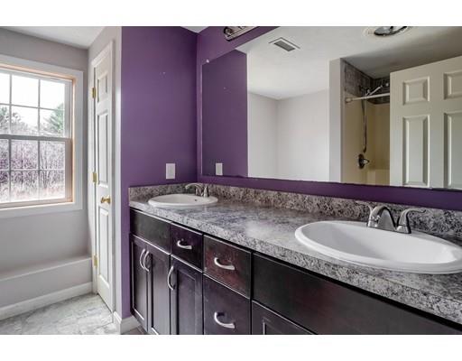 246 Pleasantdale Road Rutland, MA 01543 - Photo 24 of 29 a bathroom with a granite countertop sink and a mirror