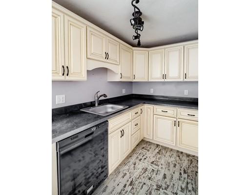 246 Pleasantdale Road Rutland, MA 01543 - Photo 25 of 29 a kitchen with stainless steel appliances granite countertop a sink stove and cabinets