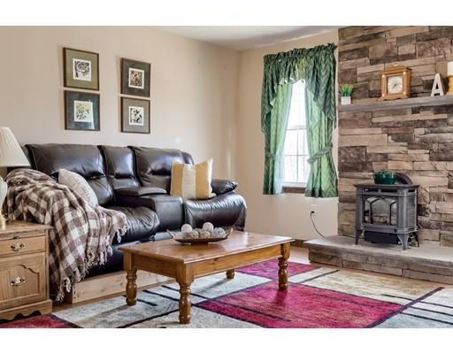 246 Pleasantdale Road Rutland, MA 01543 - Photo 7 of 29 a living room with furniture and a fireplace