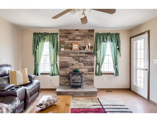 246 Pleasantdale Road Rutland, MA 01543 - Photo 8 of 29 a living room with furniture and a fireplace