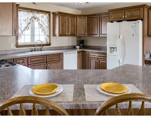 246 Pleasantdale Road Rutland, MA 01543 - Photo 10 of 29 a kitchen with stainless steel appliances granite countertop a sink and a refrigerator