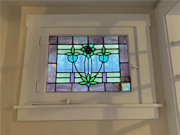 a white vase with flowers in it