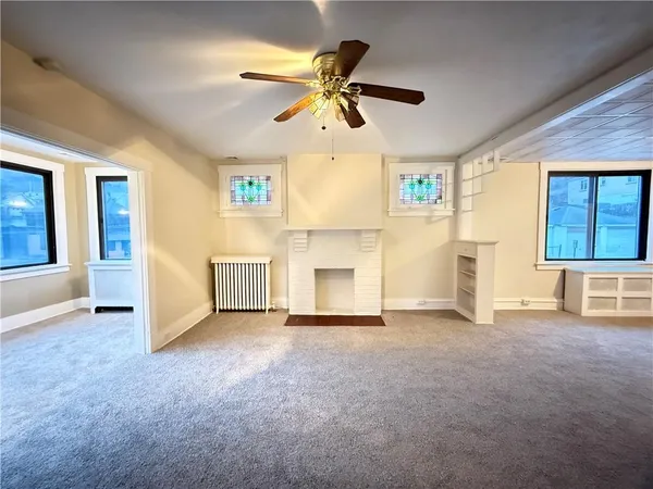 a view of an empty room with a window