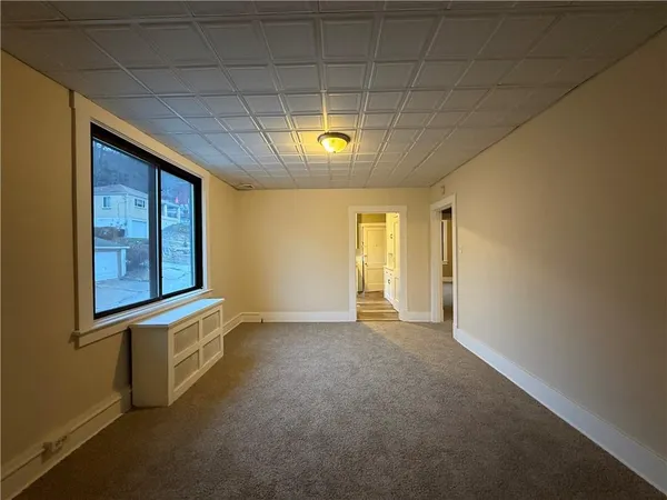 a view of an empty room with a window