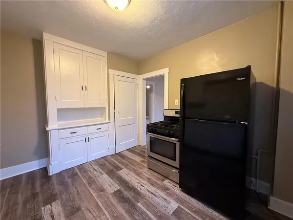 a kitchen with granite countertop cabinets and steel stainless steel appliances