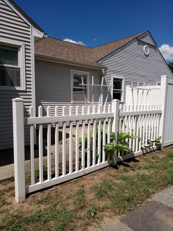 81 Mitchell Drive, Unit 81 Chicopee, MA 01022 - Photo 11 of 18 a view of a house with a small yard