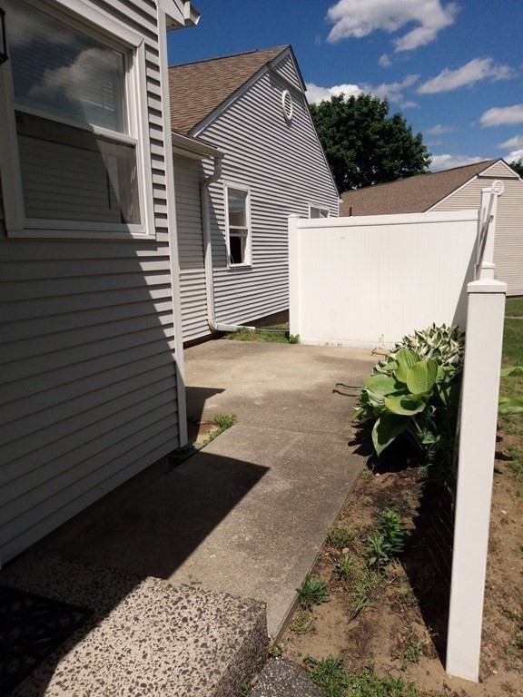 81 Mitchell Drive, Unit 81 Chicopee, MA 01022 - Photo 13 of 18 a view of a backyard with a tub