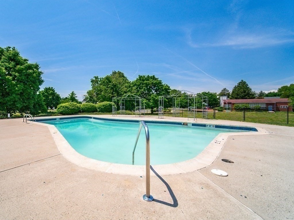 81 Mitchell Drive, Unit 81 Chicopee, MA 01022 - Photo 17 of 18 a view of a swimming pool with a yard