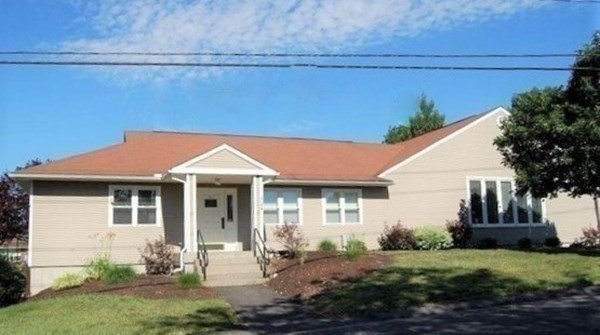 81 Mitchell Drive, Unit 81 Chicopee, MA 01022 - Photo 18 of 18 a front view of a house with a yard